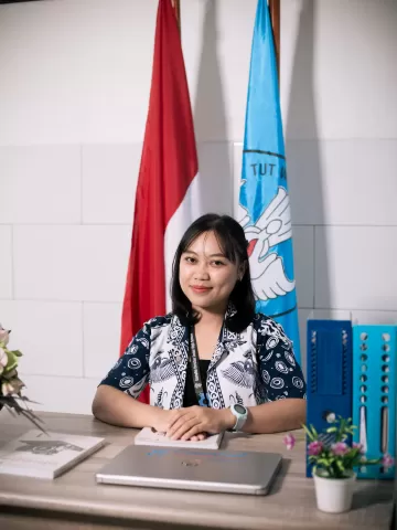 Christin Ekaristi Modingge, S.Pd., Gr.